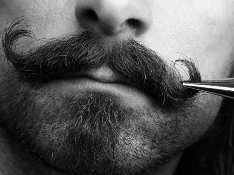 Close-up of a man with a handlebar mustache