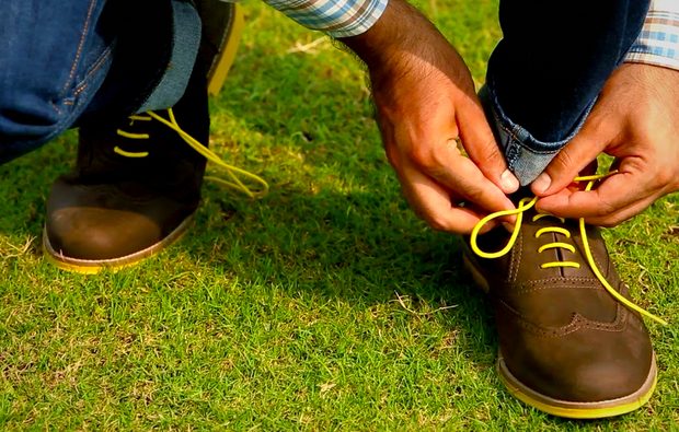 casual brogue on feet with grass