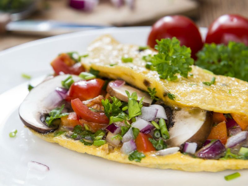 stuffed omelet on a plate.
