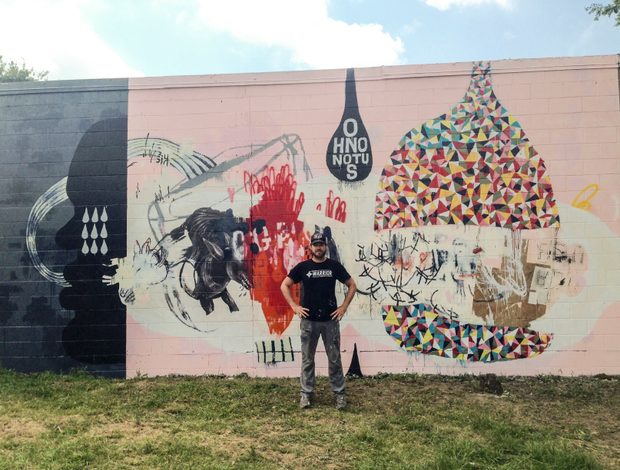 Tim in front of his mural for Charleston's artistic non-profit Enough Pie