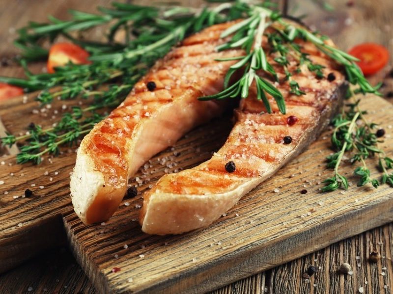 Grill salmon on a cutting board