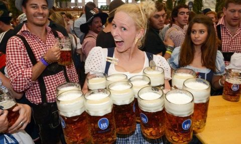Woman excited to hold beers.