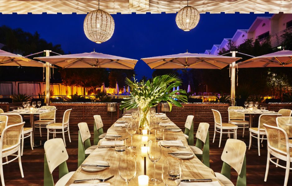 nautilus a sixty hotel adds jet set charm to miami beach driftwood room patio 01 adrian gaut for hotels