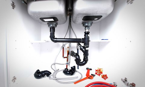 The underside of a kitchen sink