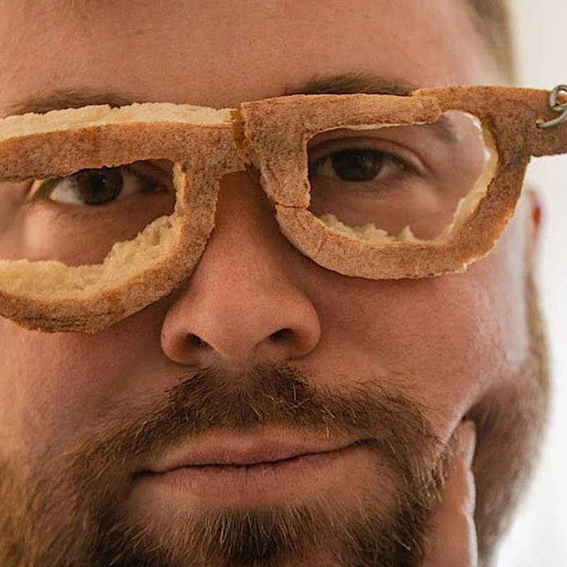 Phillip Schlesser in baguette glasses