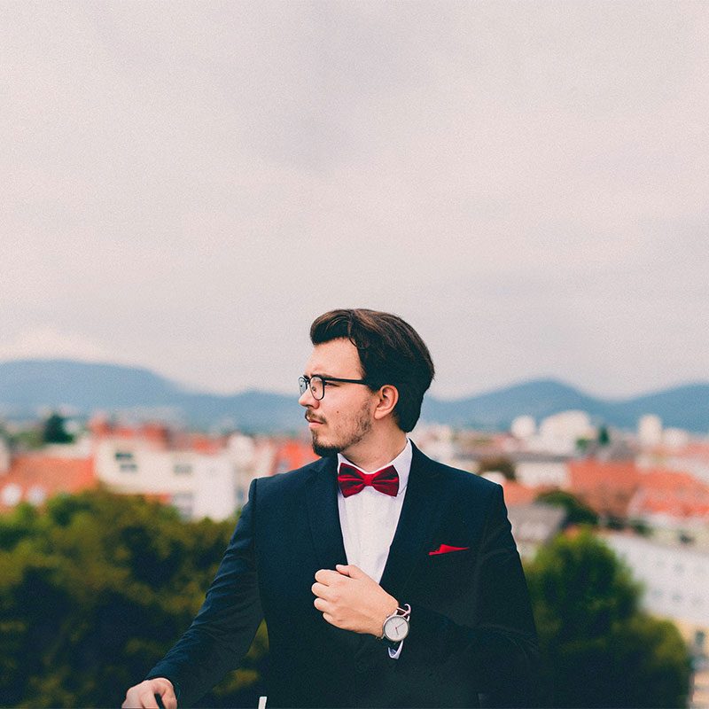 Man in red bowtie in profile