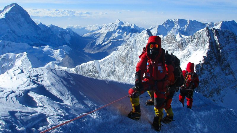 Climbers with bottled oxygen on a ridge near the summit of Mount Everest.