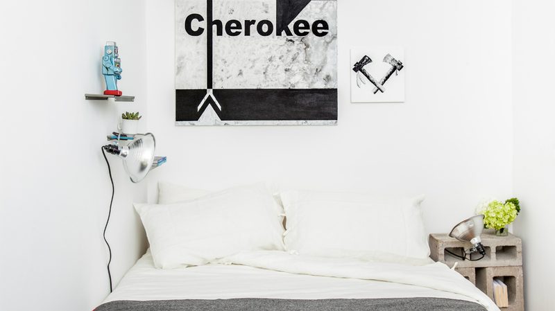 playful-bedroom-with-navajo-artwork-and-concrete-side-table