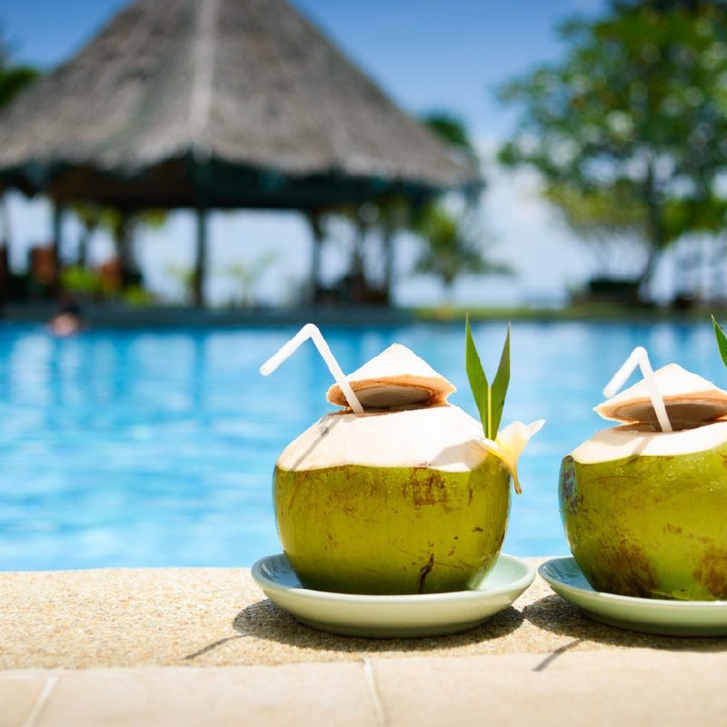Two coconut drinks by the pool.