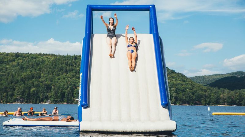 Camp No Counselors People on Slide over Water