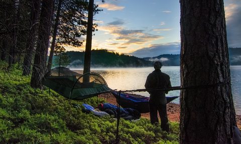 Comfort camping gear, campfire comforts, hammock in campsite