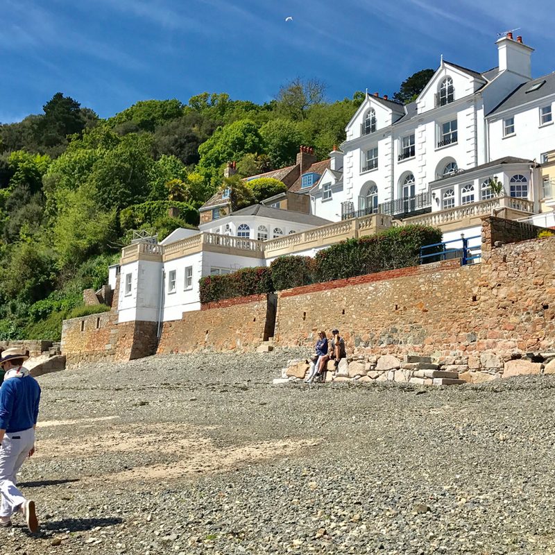 Exploring the rocky beaches of St. Aubin Old Jersey Island UK