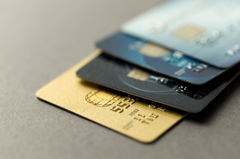 credit cars in a stack, the points guy, rewards points