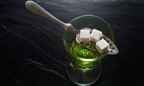Absinthe with sugar cubes and spoon