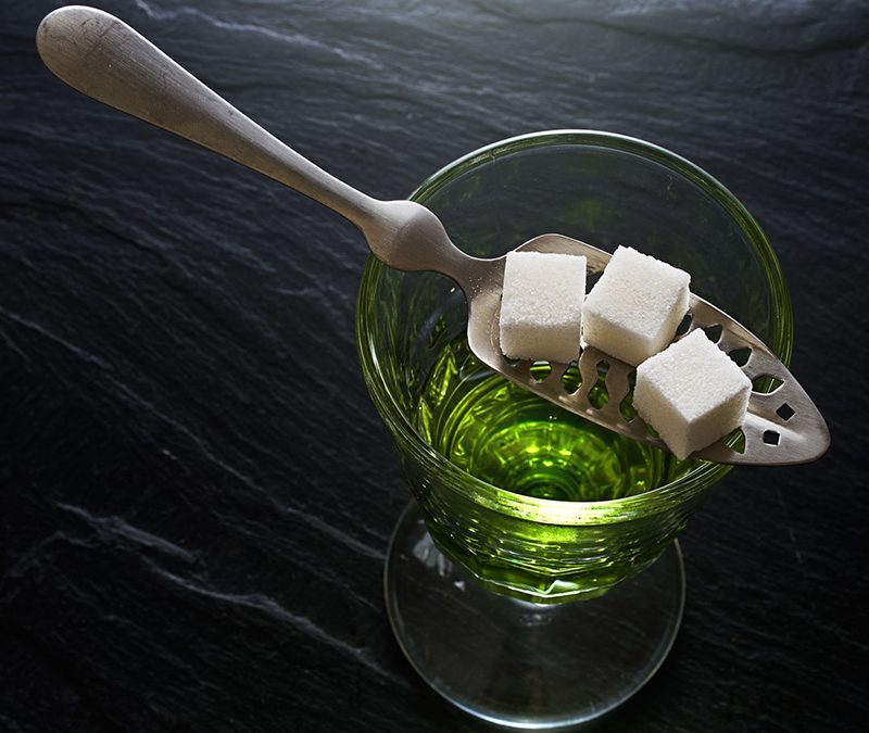 Absinthe with sugar cubes and spoon