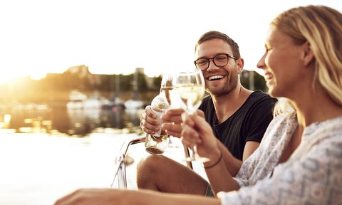 104208 autosave v1 people drinking white wine by the water