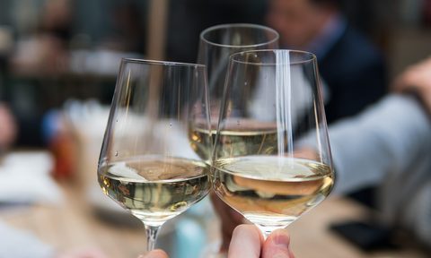 White wine clinking glasses