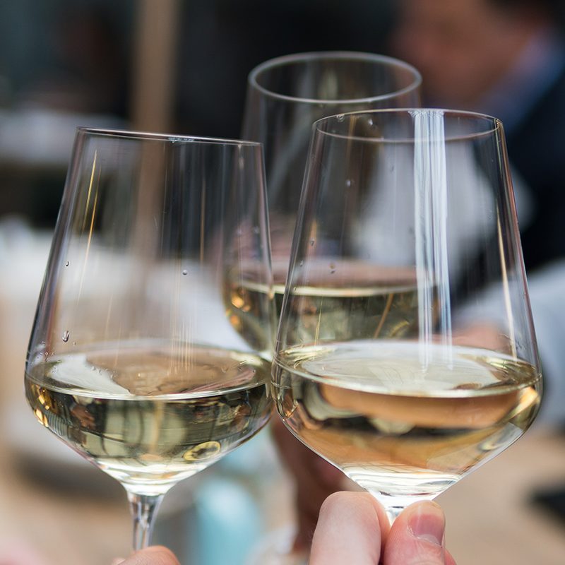 White wine clinking glasses