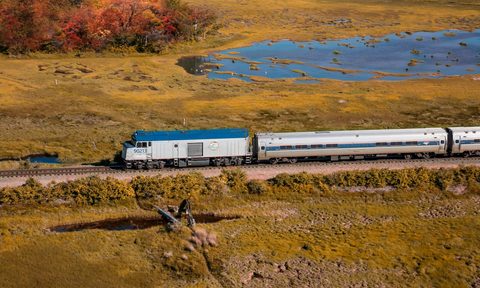 amtrak dome car amtrak train rolling through fall leaves and countryside