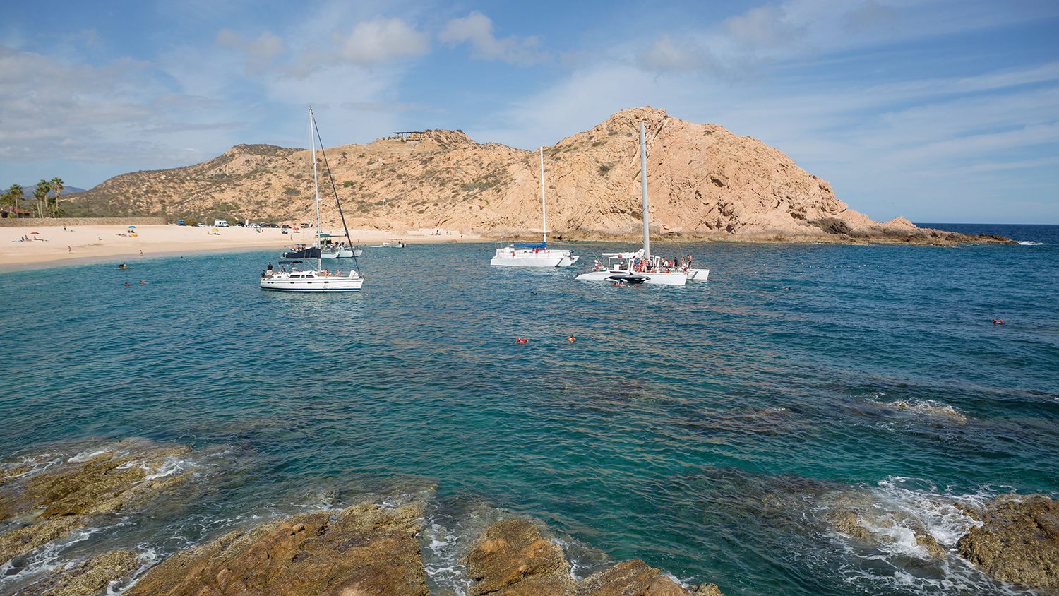 Boats and snorkelers at Santa Maria Bay in Cabo San Lucas, Mexico.
