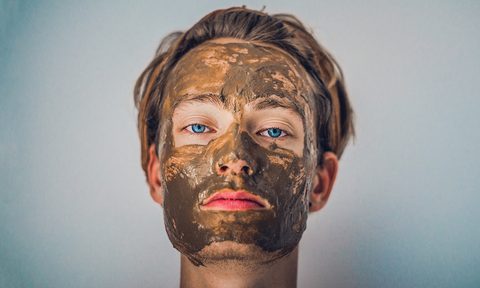 manly spa treatments for new years eve man with mud mask
