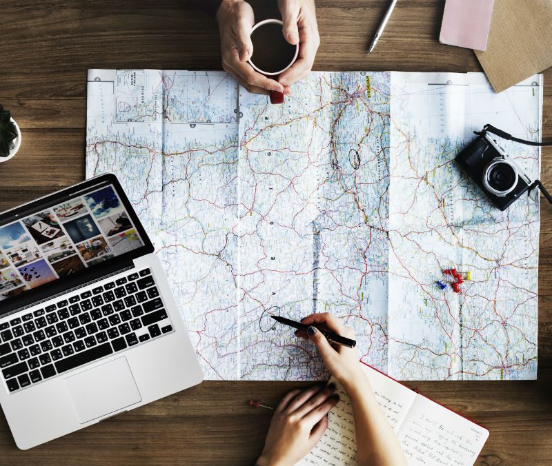 Travel planning with a computer and a map