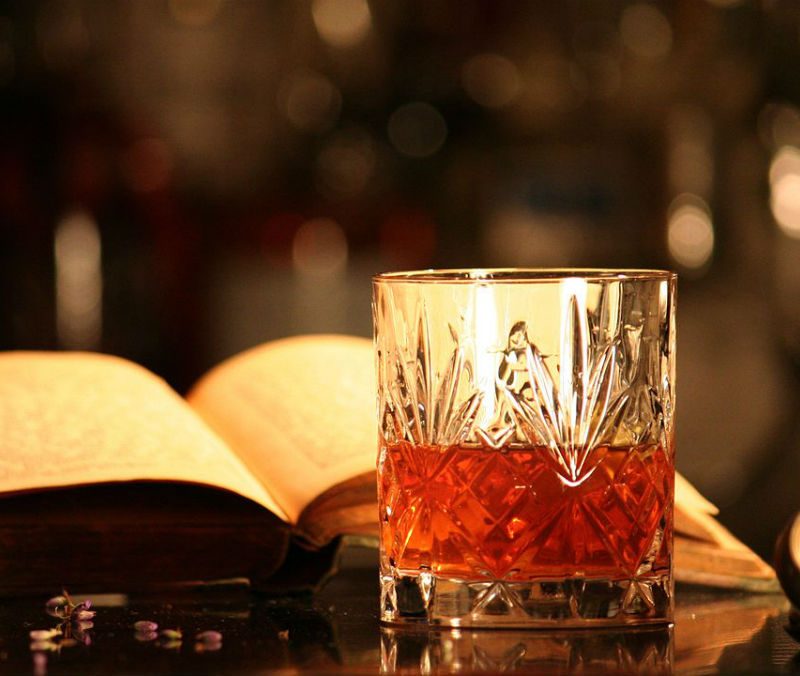 Sazerac cocktail with an open book