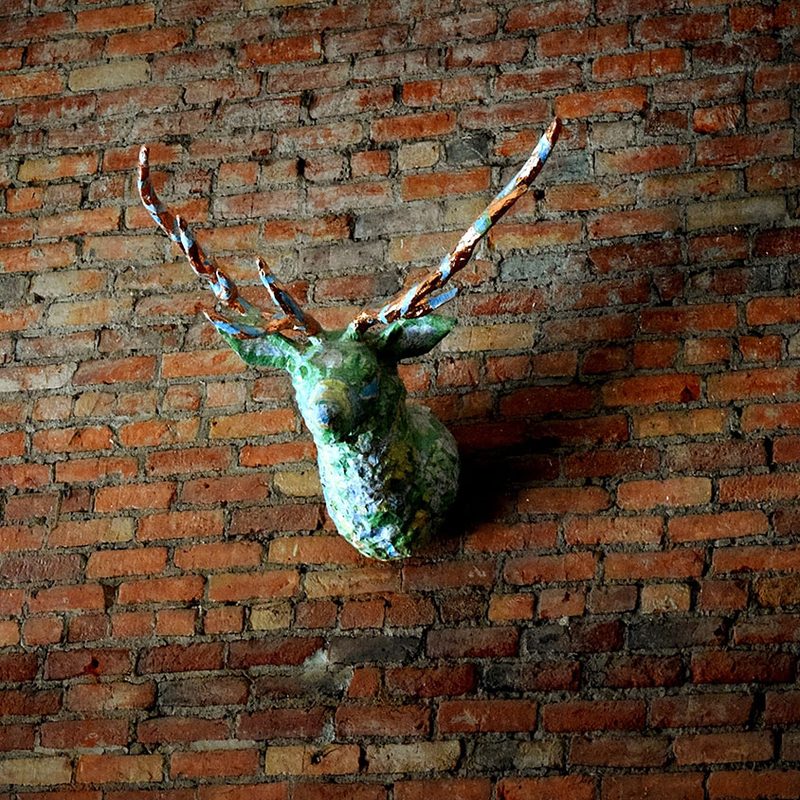 Antlers on a brick wall