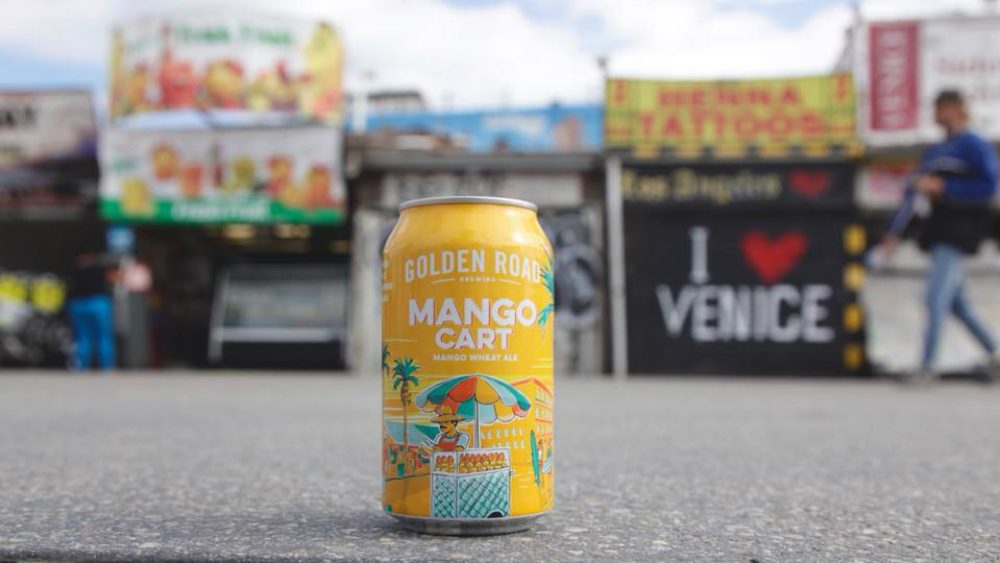 Golden Road Brewing mango cart can on the ground.