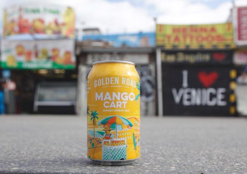 Golden Road Brewing mango cart can on the ground.