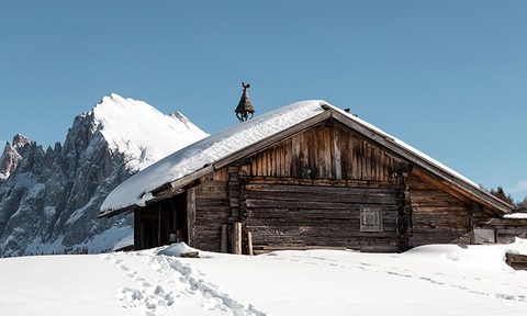 snowy log cabin