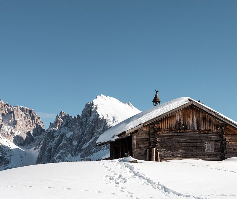 cabin on snowy hillside