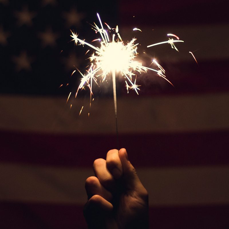 Fourth of July Sparkler and American Flag.