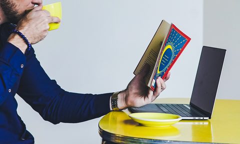 man reading book