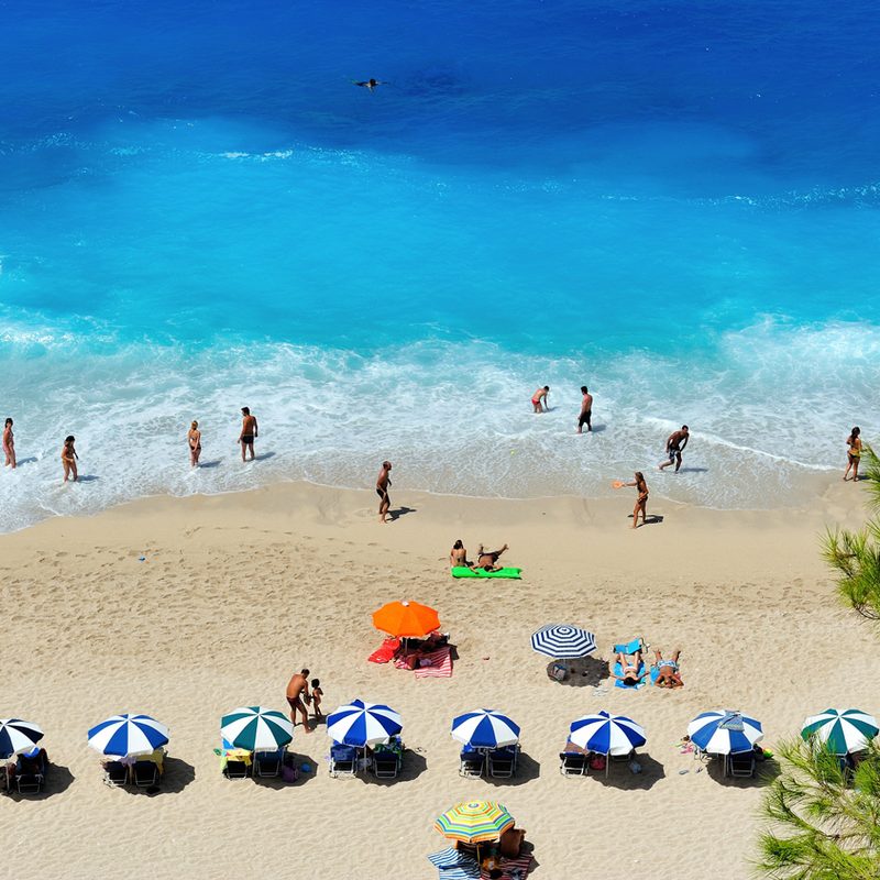 People on a beautiful beach with blue water