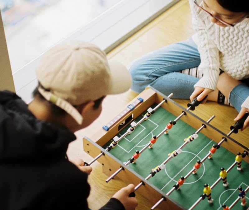 Two playing a game together on a date.