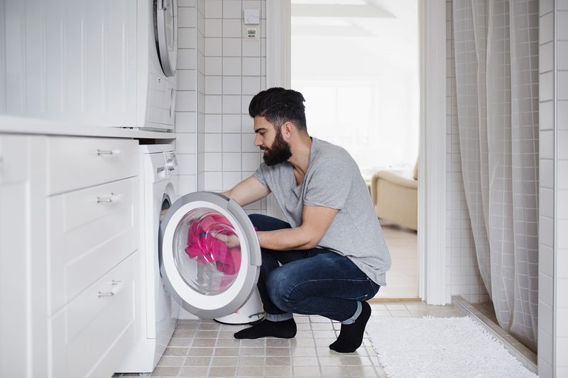 man doing laundry