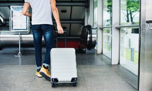 Man pulling his luggage.