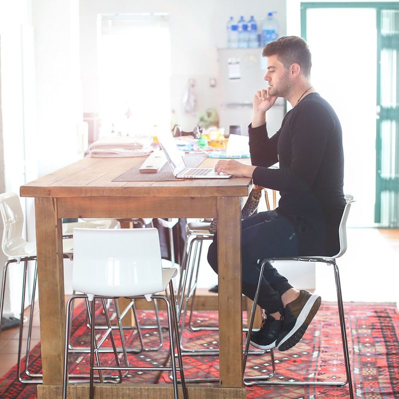 Man sitting at desk with good posture.