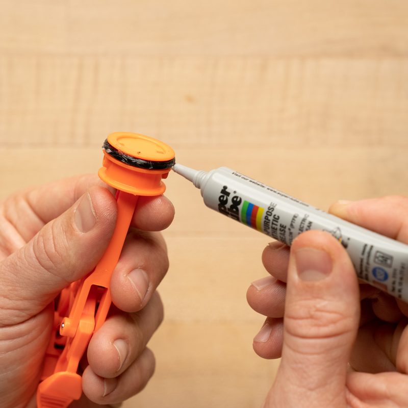 The plunger tube becomes lubricated with Super Lube.