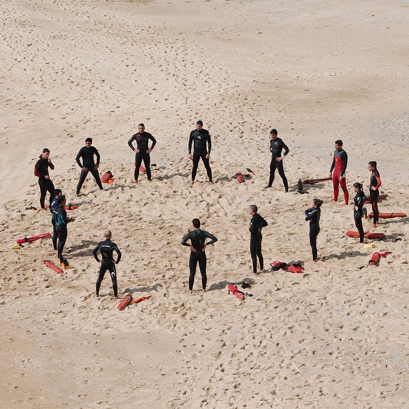 people on the beach prepping to dive