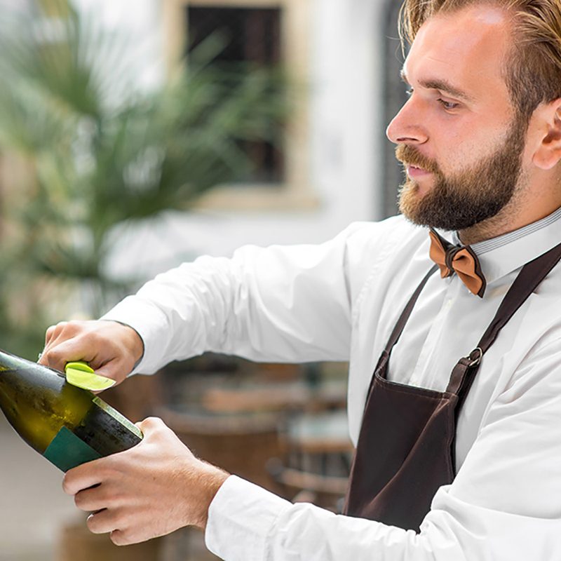 Opening a Champagne bottle by sabering