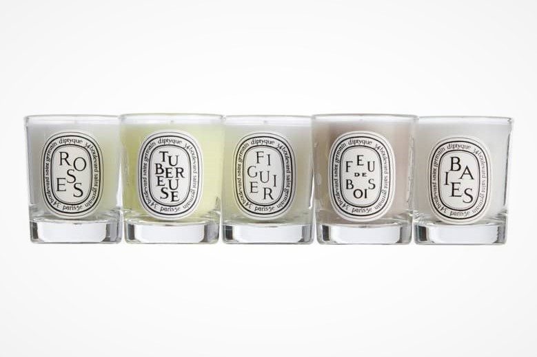 Sample Diptyque candle set on a white background.