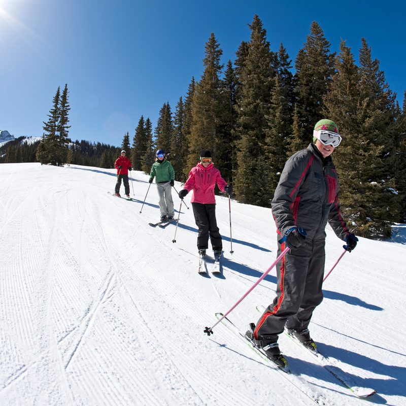 Group of skiiers learning to sk