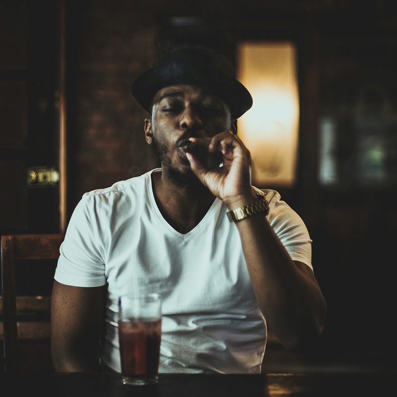Man enjoying a cigar.