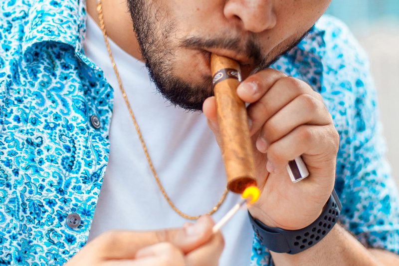lighting-cigar-with-match