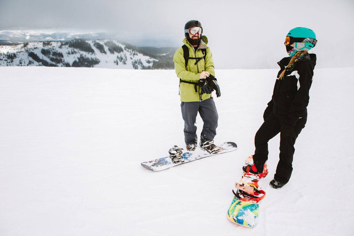 couple on snowboards
