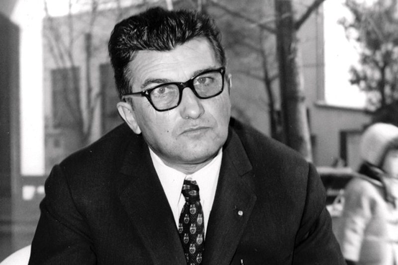 Close up of Ferruccio Lamborghini in front of trees in the back.