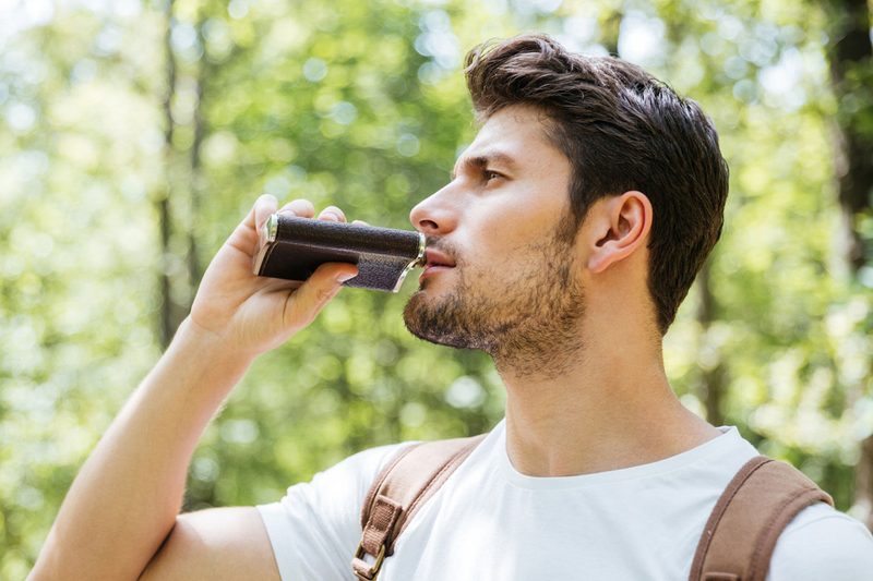 flask trail man drinking