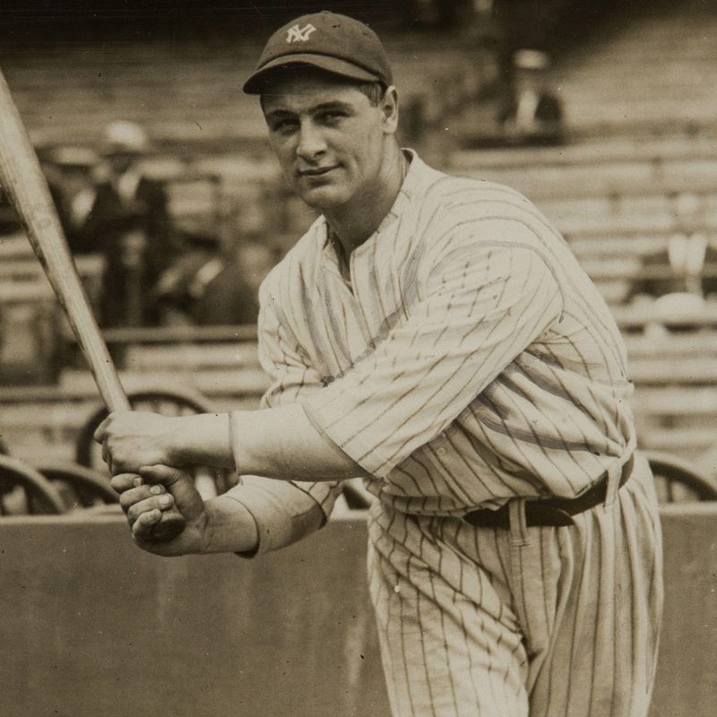 Lou Gehrig swinging a baseball bat.